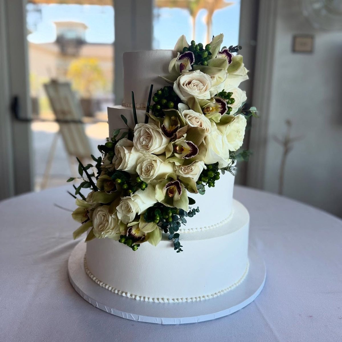 Tiered Cake with Cascading Ivory Flowers from Tarzana Bakery